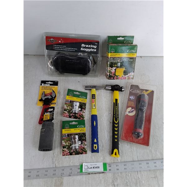 (2) Shut Off Valves, (2) Small Hammers, Stubby Adjustable Wrench, 32mm Axle Nut Socket,Goggles, Misc