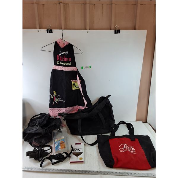 Kitchen Apron, (3) Carry Bags, (1) Jump Rope, Wine Pocket Guide, Traxon Easy Ice Grips