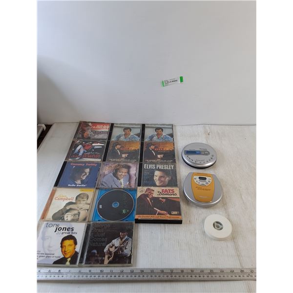 (14) CDs, Elvis, Fats Domino, Tom Jones, (2) Untested Music Players, (1) Film Reel