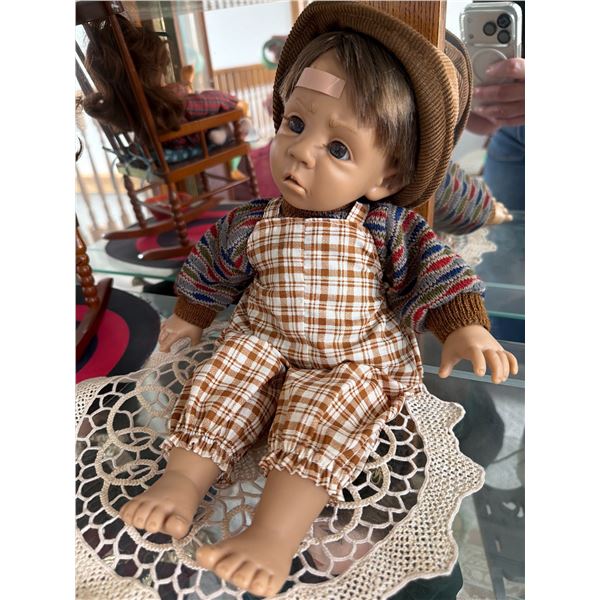 Porcelain Boy Doll with Plaid Overalls