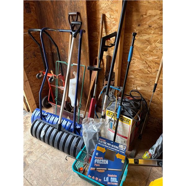 Garage Tool Lot with Shovels and Saw