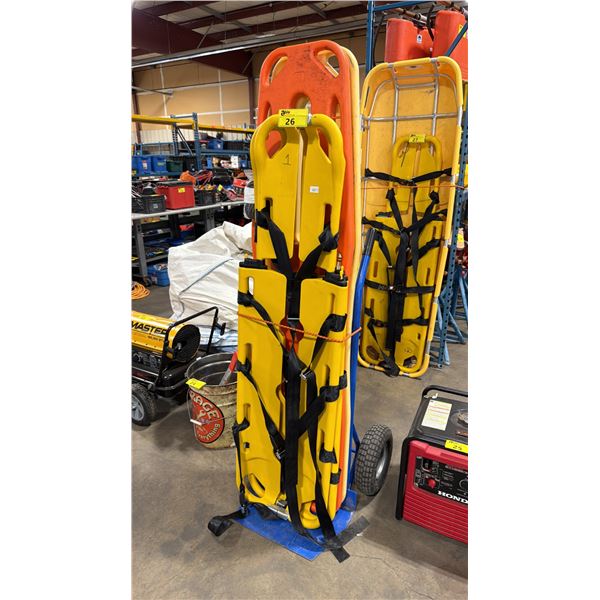 2 ADJUSTABLE PLASTIC COATED COMMERCIAL SPINEBOARDS, 1 ORANGE & 1 YELLOW PLASTIC 6' SPINE BOARDS ON
