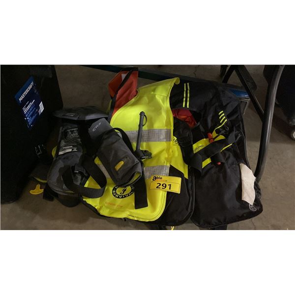 STACK OF ASSORTED MUSTANG SURVIVAL ADULT AUTOMATIC INFLATABLE LIFE JACKETS