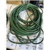 Image 2 : 2 GREEN EXTENSION CORDS. APPROX 100 FEET EACH. ONE IS FRIED AND DOESN'T WORK