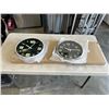 Image 1 : 3 NEW 12 INCH WALL CLOCKS. TWO ARE BLACK WITH A CHROME FINISH. ONE IS BLACK WITH A WHITE FINISH