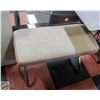Image 1 : VANITY BENCH FEATURES A METAL FRAME AND CUSHIONED