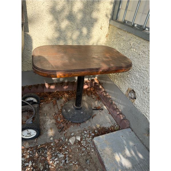Wood table with cast-iron base 32" x 20" x 28 1/2" tall