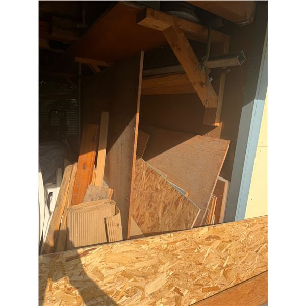Lot of wood and sawhorses