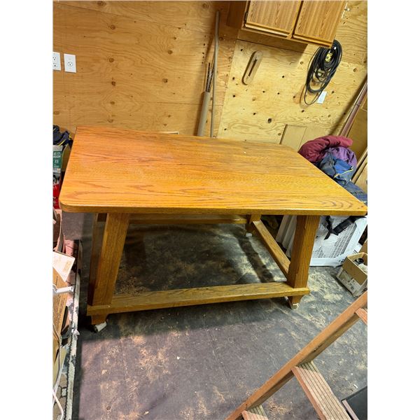 Solid oak table on casters 58" x 36" x 32" tall