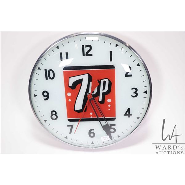 Vintage 7UP electric wall mount clock, 16" in diameter, working at time of cataloguing, needs bulb
