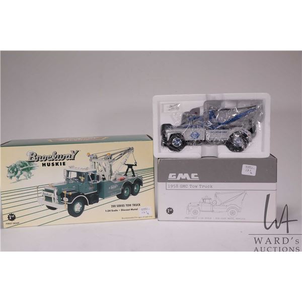 Two 1st Gear 1:34 scale die cast vehicles including 200 Series Mack Tow Truck and a 1958 GMC Tow Tru