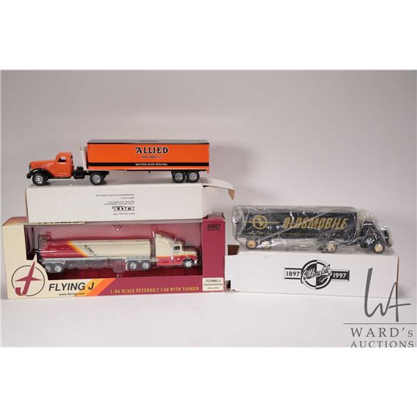 Three Ertl 1:64th scale truck and tractor units including Allied Van Lines die cast bank, 100 Years 