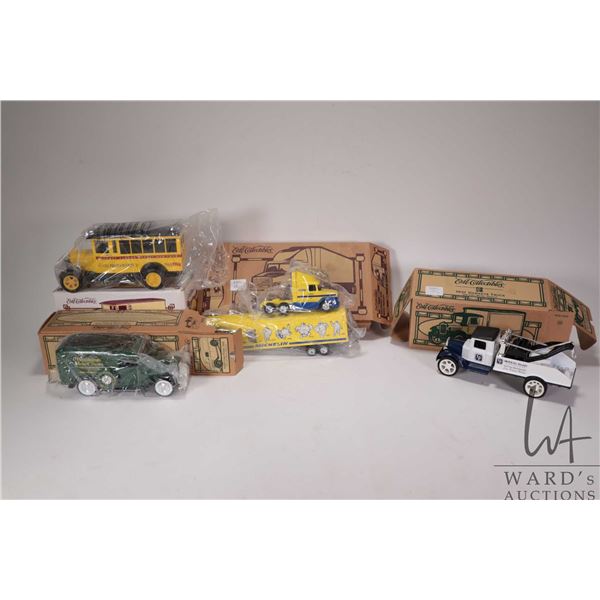 Four Ertl collectible die cast banks including 1936 Ford Panel Van 1927 Graham Panel Van, 1931 Hawke