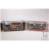 Image 1 : 2 1:18 scale collectible die cast cars including Maisto 1948 Chevrolet Fleetmaster Woody and a Road 