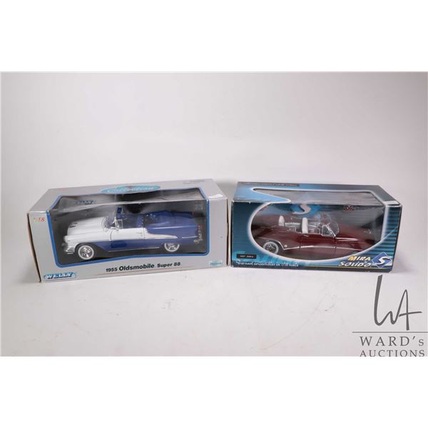 2 1:18 scale collectible die cast cars including Welly 1955 Oldsmobile Super 88 and a Solido 1953 Bu