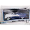 Image 2 : 2 1:18 scale collectible die cast cars including Welly 1955 Oldsmobile Super 88 and a Solido 1953 Bu