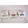 Image 1 : 3 1:43 scale Franklin Mint die cast collectible cars including 1957 Ford Thunderbird, 1957 Chevrolet