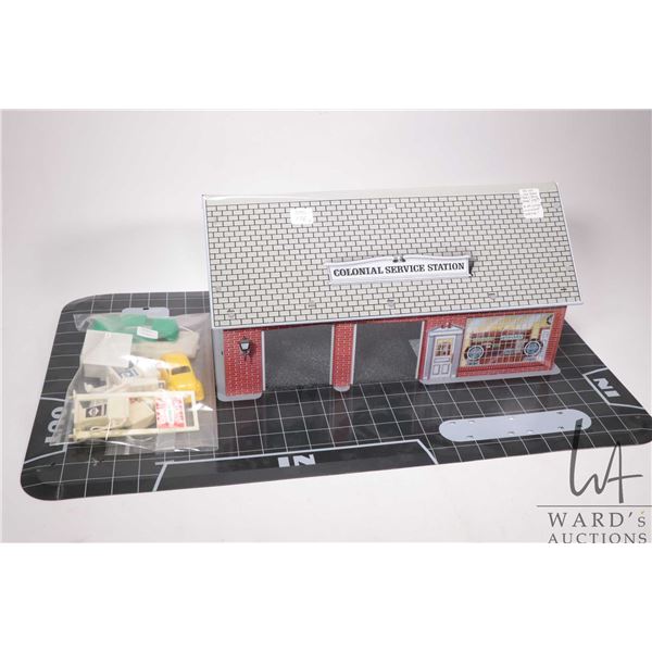 Vintage lithoed pressed tin 1968 Marx Colonial Service Station with accessories