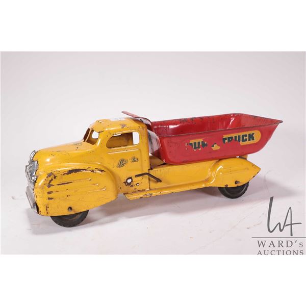Vintage Lincoln pressed steel dump truck circa late 1940's, 14" in length