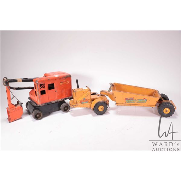Two vintage pressed Marx steel toys including Lumar Earth Hauler and Lumar Excavator, note: both nee