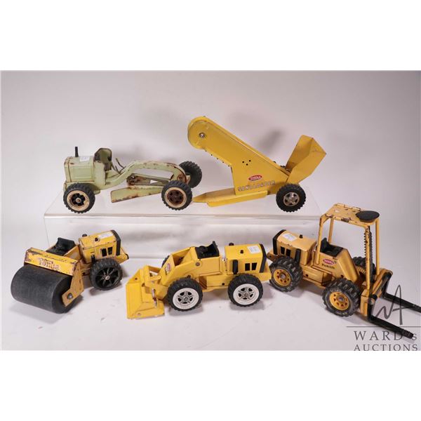 Five vintage Tonka construction toys including grader, front end loader, fork lift, steam roller and