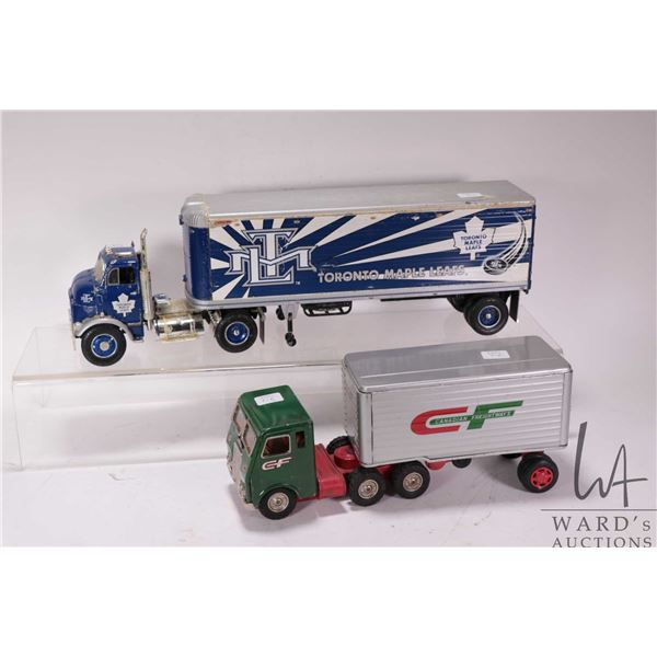 Two vintage semi trucks including Japanese tin White Freightliner with Canadian Freightways trailer,