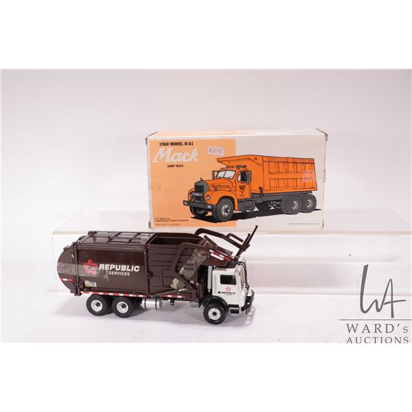 Two 1st Gear die cast 1:34 scale Mack Trucks including a 1960's Model B-61 and a garbage truck