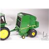 Image 4 : Three Ertl 1:18 scale die cast John Deere toys including 4450 tractor, 568 round bailer with hay bal