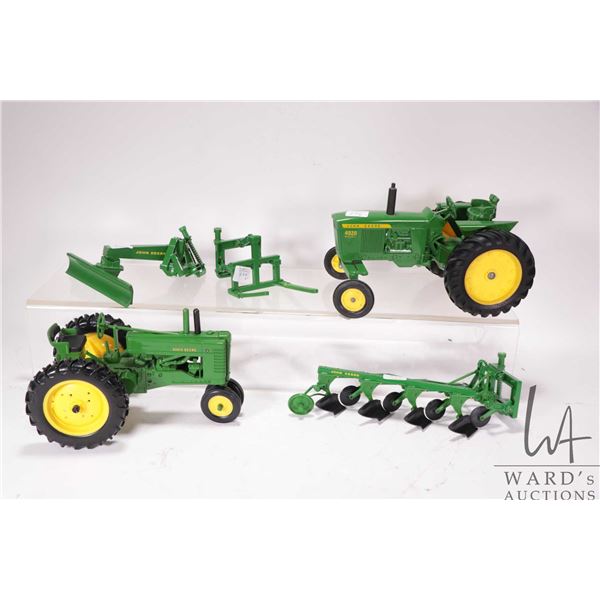 Two Ertl 1:18 scale die cast John Deere tractors including a Model A Rowcrop and a 4020 diesel plus 