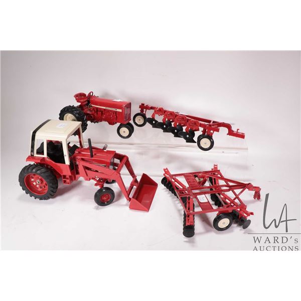 Four Ertl 1:16 scale die cast International tractors and impliments including 1586 with loader, Rowc