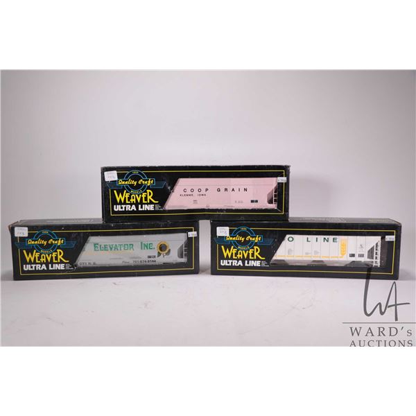 Three Weaver Ultra Line O gauge train cars including Soo Line grain car, Farmer's Elevator grain car