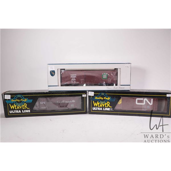 Two Weaver Ultra Line box cars and a Crown Model Products box car, all O gauge CN Rail