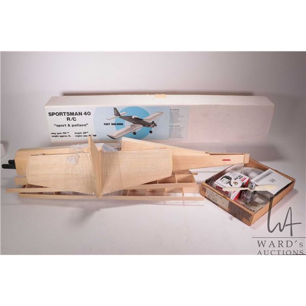 A partially assembled Sportsman 40 RC Sport & Pattern wooden model airplane, 24LA-S OS engine, Hanga