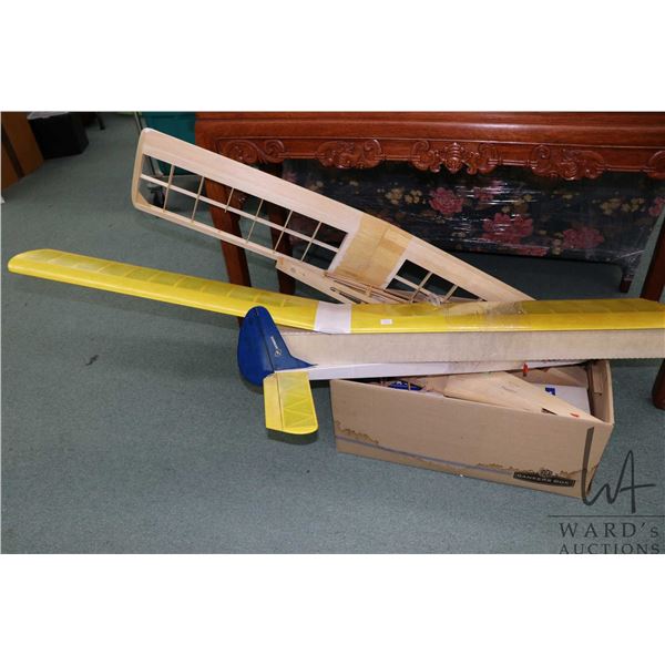 Three partially built wooden airplane kits, including Aerobipe R-C Sport Biplane, completeness not c