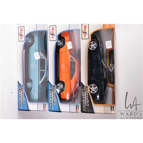 Three Maisto die cast model cars including a 2014 Corvette Stingray, 1969 Dodge Charger R/T and a 19
