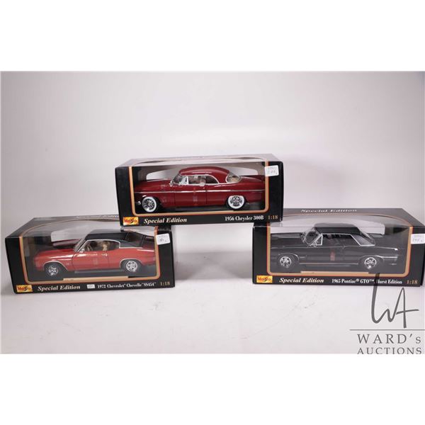 Three Maisto die cast model cars including 1956 Chrysler 300 B, 1965 Pontiac GTO Hurst Edition and a