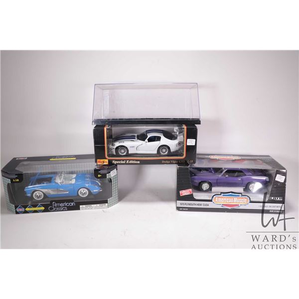 Three die cast model cars including Maisto Dodge Viper GT2, Ertl American Muscle 1970 Plymouth Hemi 