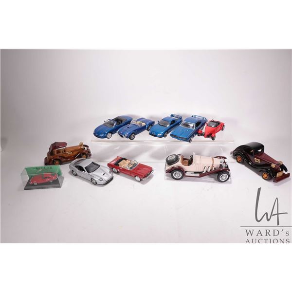 Selection of metal and wooden model cars including Burago 1928 Mercedes-Benz SSK, Burago Cobra 427, 