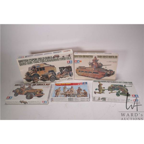 One Italira British Tank Troops model kit and four Tamiya WWII vehicle model kits, all new in box