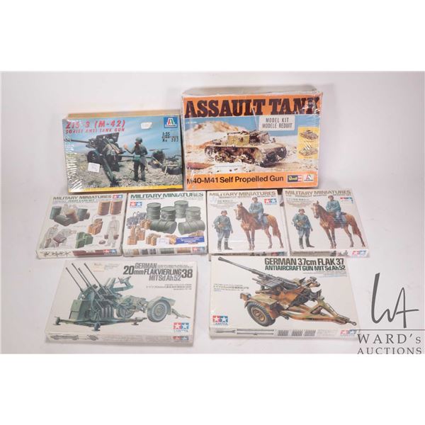 Eight 1:35 scale model kits WWII vehicle model kits including Revel, one Italari and six Tamiya all 