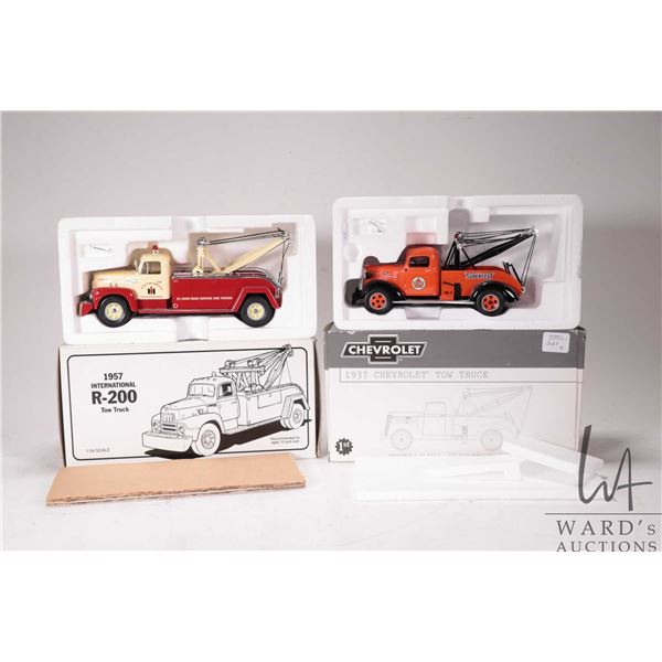 Two First Gear die cast cars including 1: 30th scale 1937 Chevrolet tow truck and a 1:34th scale 195