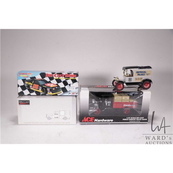 Four die cast banks, various makers and scales