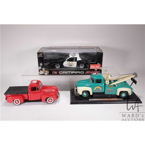 3 1/18th scale die cast toys including 1982 Camaro Z28 Police Cruiser in original box, 1956 F-100 To
