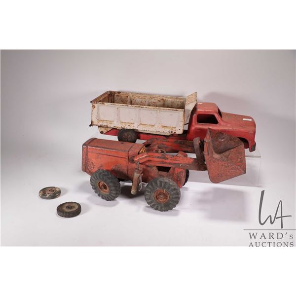 2 Vintage pressed tin toys including Structo hydraulic control dump truck and a Ny-lint front end lo