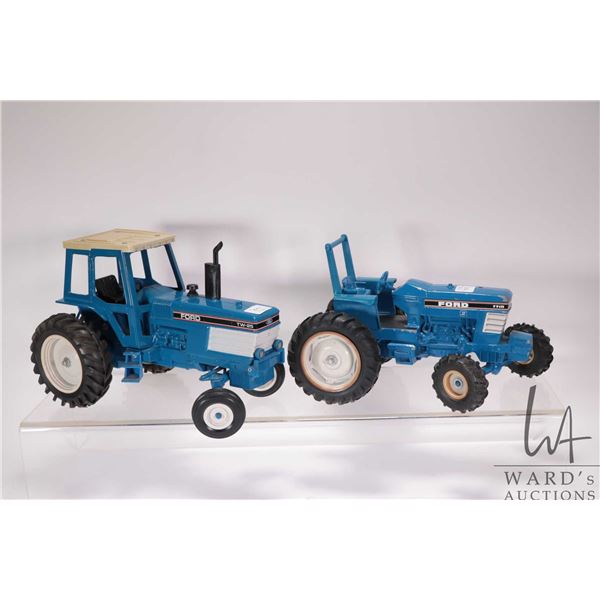 2 1/18th scale die cast Ford tractors including an ERTL 7710 and a TW-25