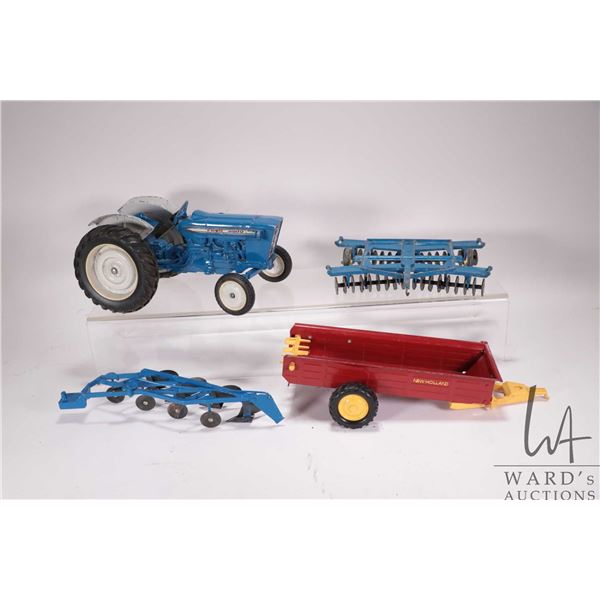 Selection of ERTL 1/18th scale die cast farm toys including a Ford 4000 tractor, a disc, 4 bottom pl