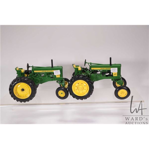 2 1/18th scale die cast John Deere tactors including a 720 and a 620