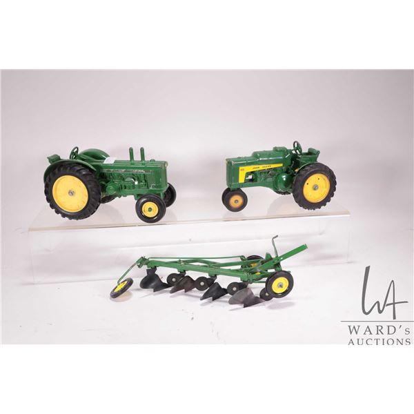 2 vintage 1/18th scale die cast ERTL John Deere tractors including a 630 Row Crop and an 820 Diesel 