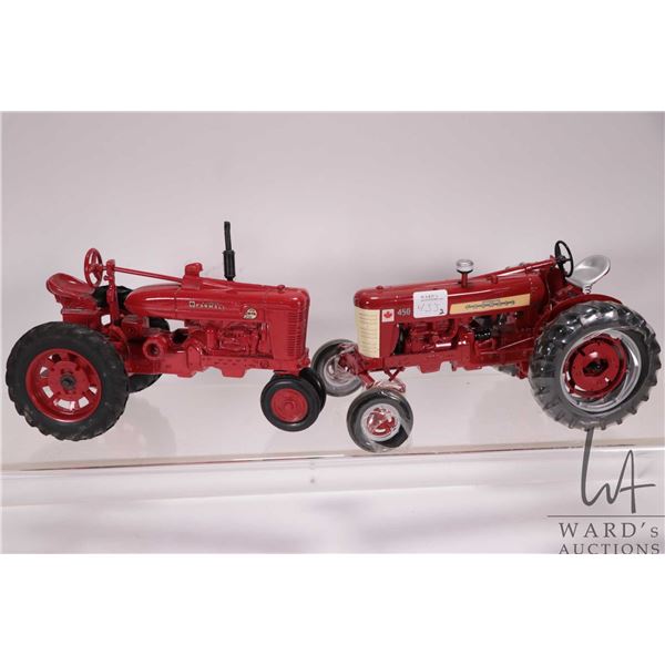 2 die cast 1/18th scale Farmall tractors including an ERTL M-TA Super Row Crop and a 450