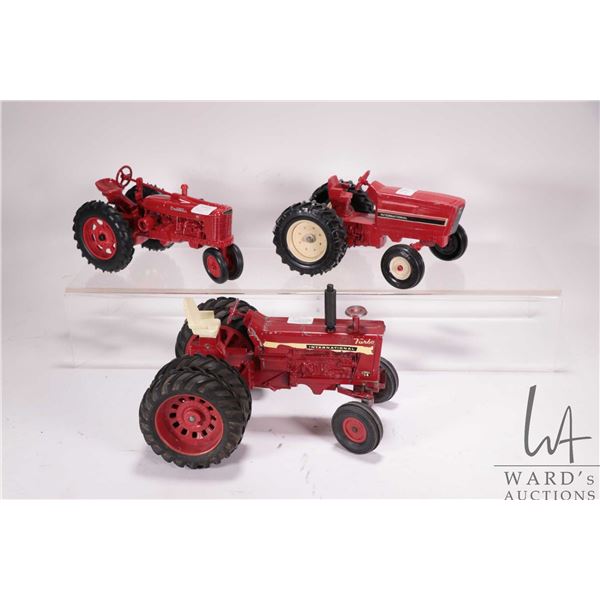 3 Vintage ERTL 1/18th scale die cast tractors including Farmall Model H Row Crop, International 1450